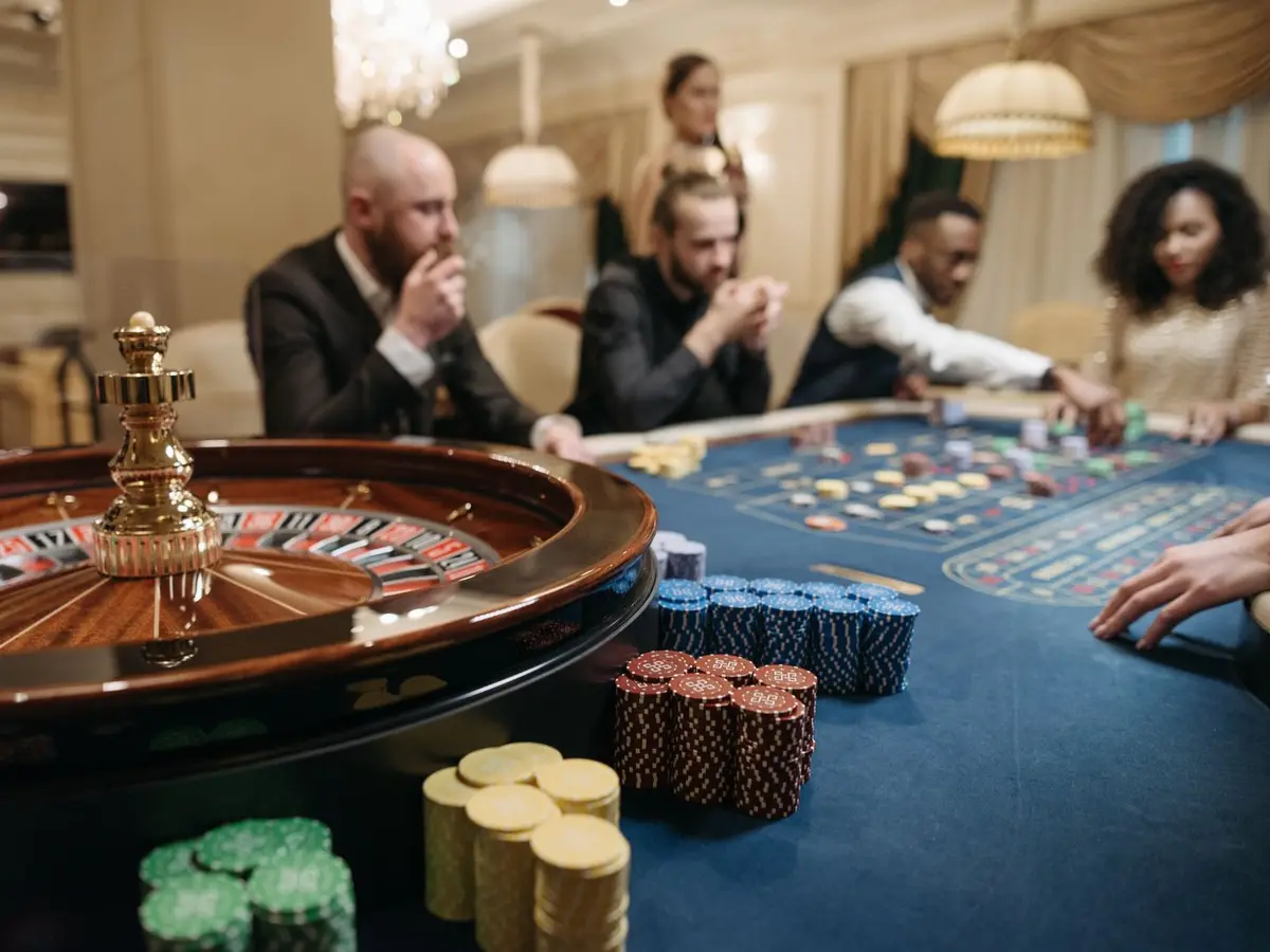 Guests playing roulette at a casino table