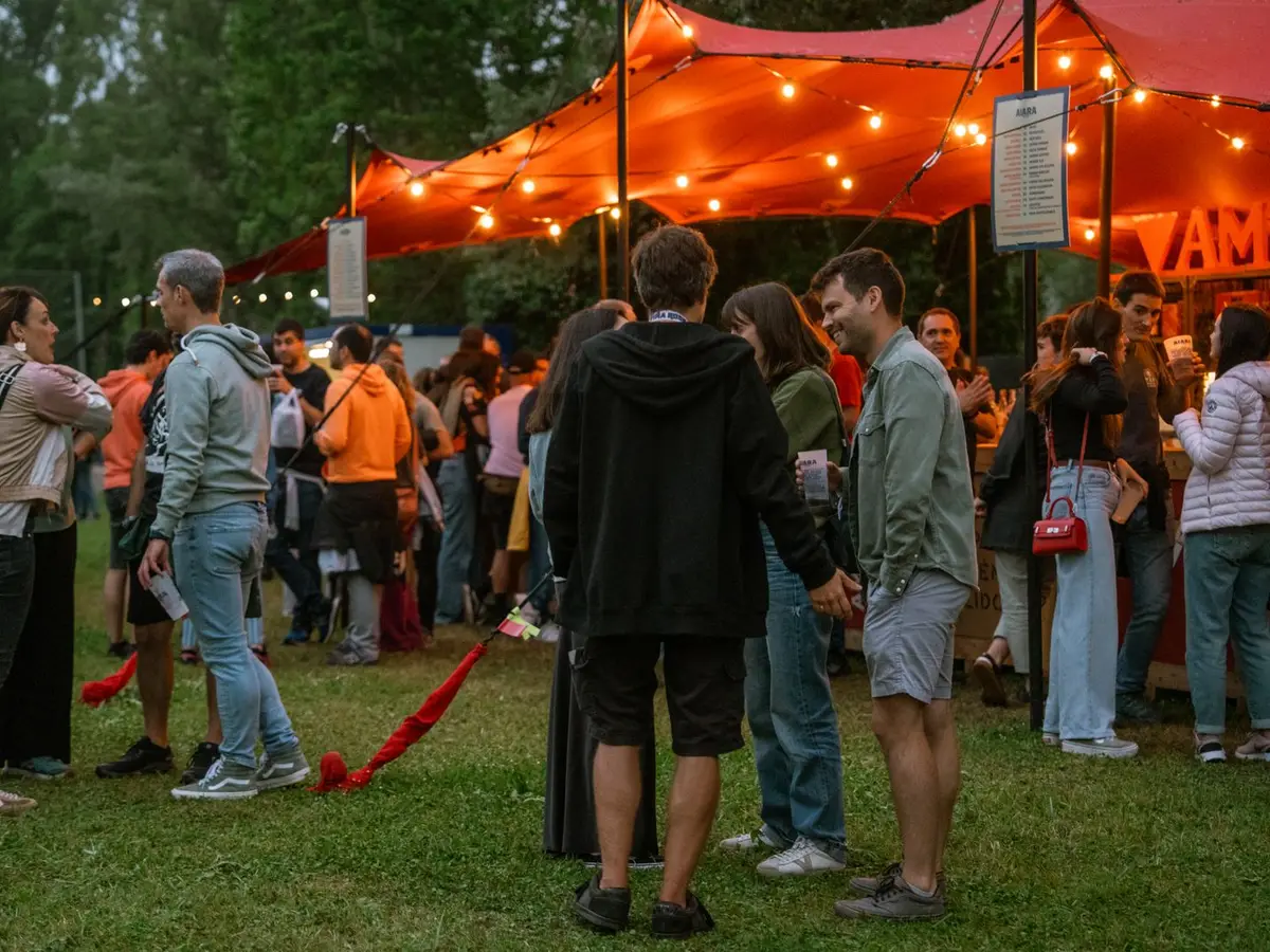 Guests gathering at the entrance of an outdoor evening event